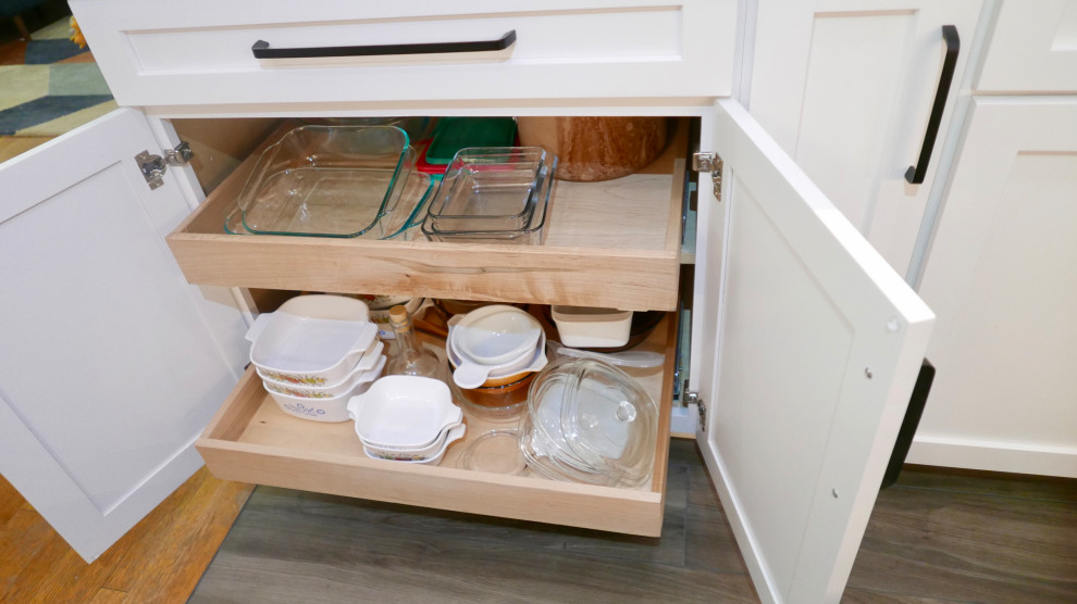 Inspiration for a mid-sized transitional galley porcelain tile and gray floor eat-in kitchen remodel with an undermount sink, shaker cabinets, white cabinets, quartz countertops, white backsplash, subway tile backsplash, black appliances, no island and white countertops