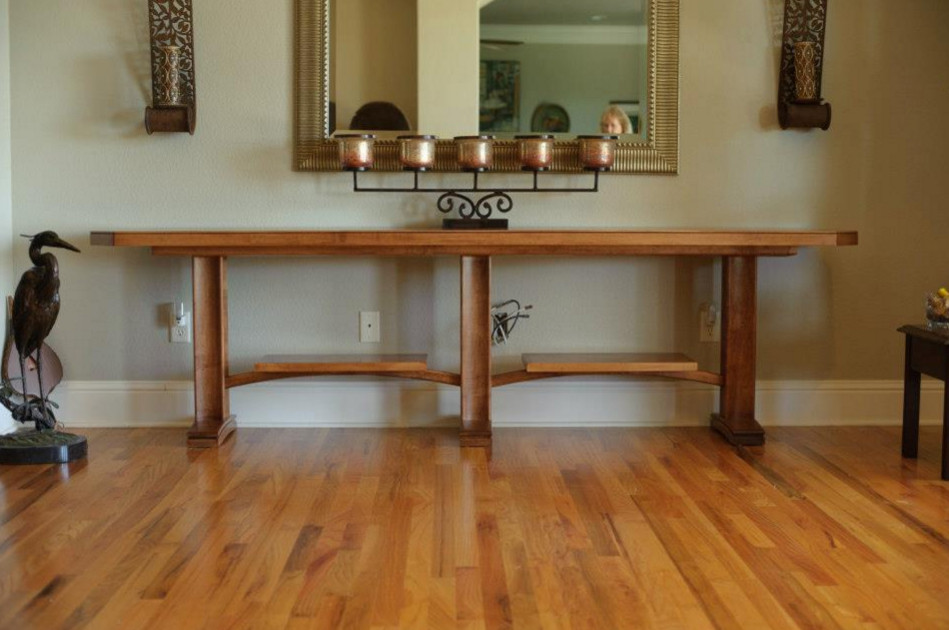 Example of a mid-sized transitional medium tone wood floor hallway design with gray walls