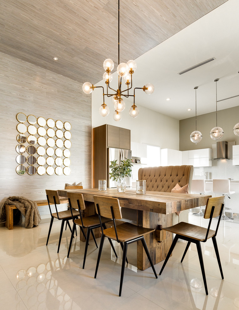 Inspiration for a mid-sized transitional kitchen/dining combo in Austin with white walls and porcelain floors.