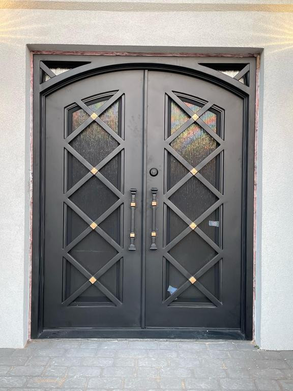 This is an example of a modern front door in New York with a double front door.