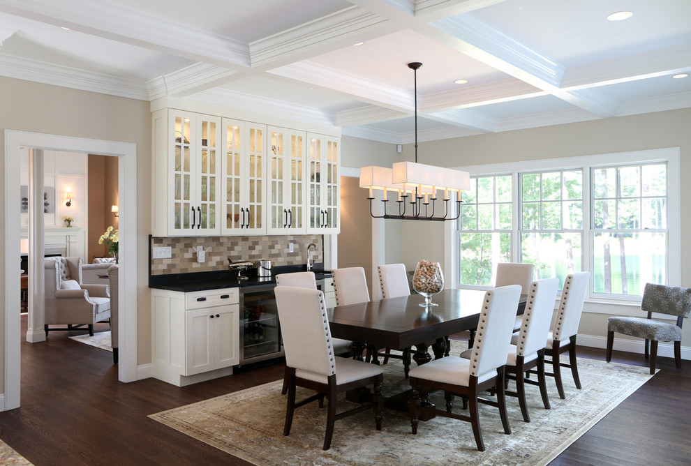 Design ideas for an expansive traditional kitchen/dining combo in Boston with beige walls and medium hardwood floors.