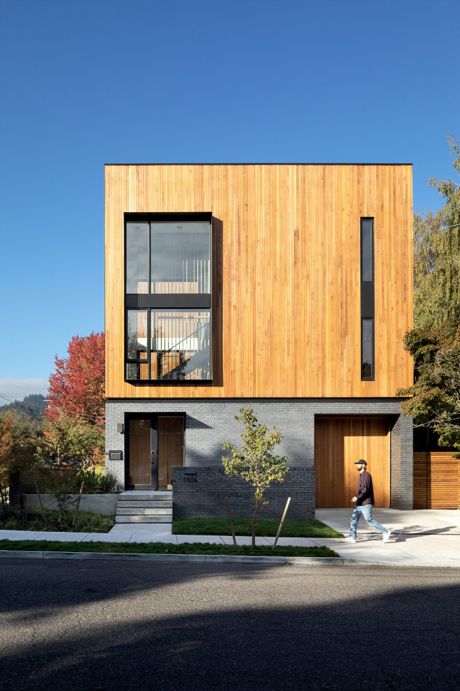Réalisation d'une façade de maison minimaliste en bois à deux étages et plus.