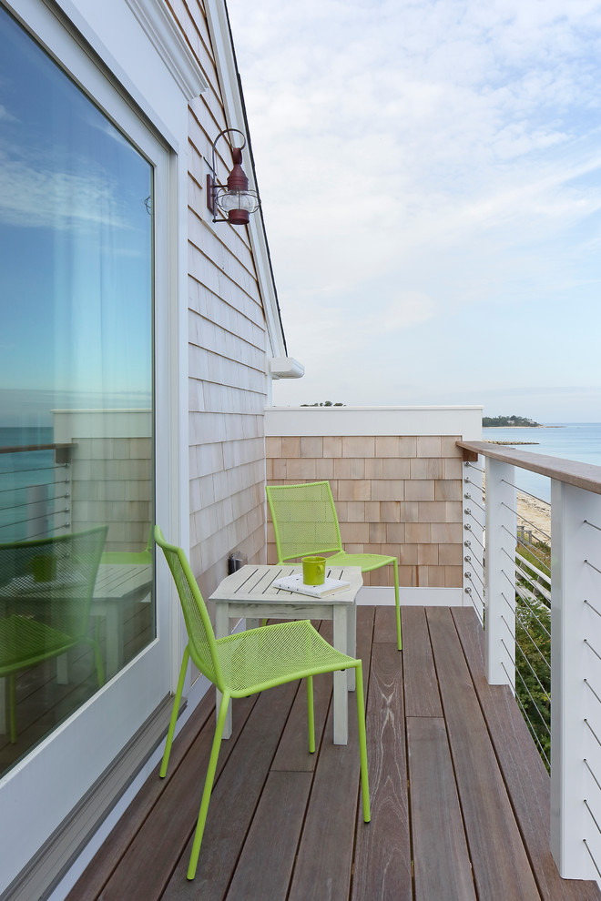 Photo of a beach style balcony in Boston with no cover.