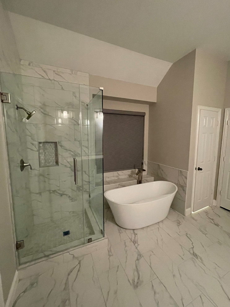 Design ideas for a large contemporary bathroom in Houston with shaker cabinets, grey cabinets, a freestanding tub, porcelain floors, engineered quartz benchtops and a double vanity.