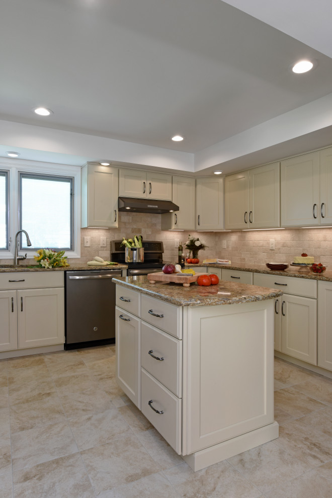 Inspiration for a mid-sized transitional u-shaped porcelain tile, beige floor and tray ceiling enclosed kitchen remodel with an undermount sink, flat-panel cabinets, beige cabinets, quartz countertops, beige backsplash, travertine backsplash, black appliances, an island and beige countertops