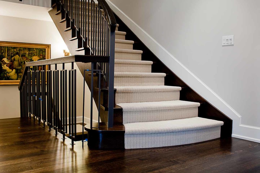 Inspiration for a mid-sized traditional carpeted curved staircase in Toronto with carpet risers.