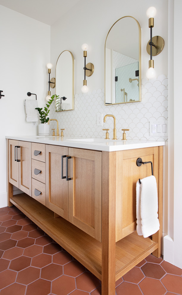 Transitional master white tile terra-cotta tile, brown floor and double-sink bathroom photo in Austin with medium tone wood cabinets, white walls, white countertops and a built-in vanity