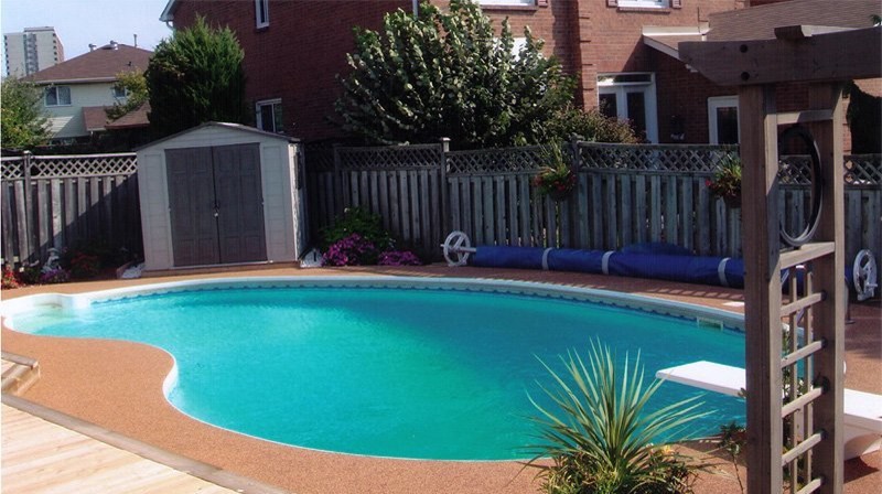 Mid-sized backyard decomposed granite and kidney-shaped lap pool photo