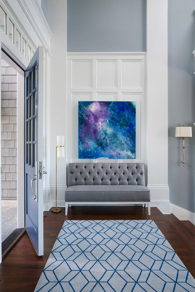 Single front door - large transitional medium tone wood floor and brown floor single front door idea in Minneapolis with a blue front door and gray walls