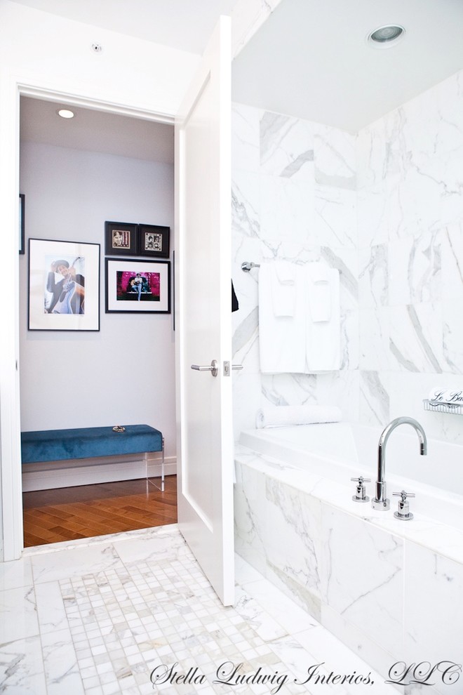 Tub/shower combo - mid-sized modern master gray tile marble floor and white floor tub/shower combo idea in Philadelphia with flat-panel cabinets, dark wood cabinets, an undermount tub, a one-piece toilet, white walls, an undermount sink, marble countertops and a hinged shower door