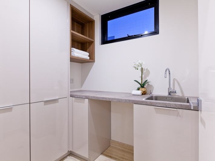 Photo of a contemporary laundry room in Perth.