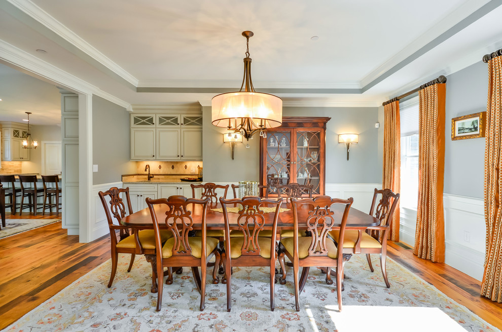 Photo of a large traditional separate dining room in Boston with grey walls.