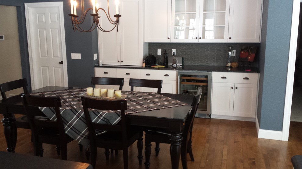 Kitchen/dining room combo - mid-sized transitional medium tone wood floor kitchen/dining room combo idea with gray walls
