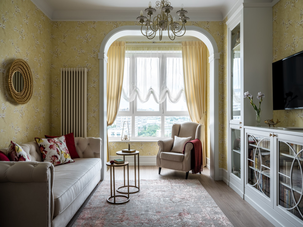 Mid-sized country open concept living room in Moscow with yellow walls, laminate floors, no fireplace, a wall-mounted tv, beige floor and wallpaper.