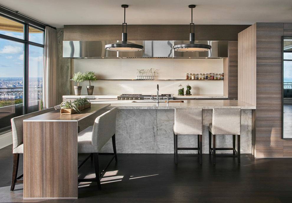 Design ideas for a mid-sized contemporary galley eat-in kitchen in Chicago with dark hardwood floors, with island, an undermount sink, flat-panel cabinets, light wood cabinets, solid surface benchtops, white splashback, stone slab splashback and stainless steel appliances.