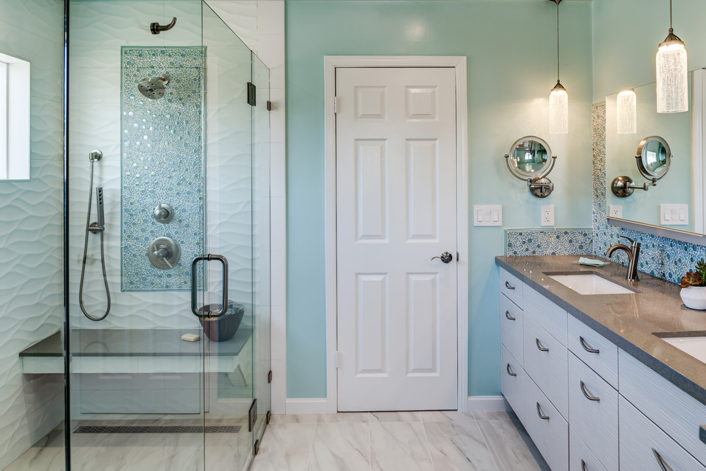 Inspiration for a mid-sized beach style master bathroom in San Francisco with flat-panel cabinets, white cabinets, a one-piece toilet, white tile, ceramic floors, an undermount sink, engineered quartz benchtops, white floor, a hinged shower door, a curbless shower, porcelain tile and green walls.