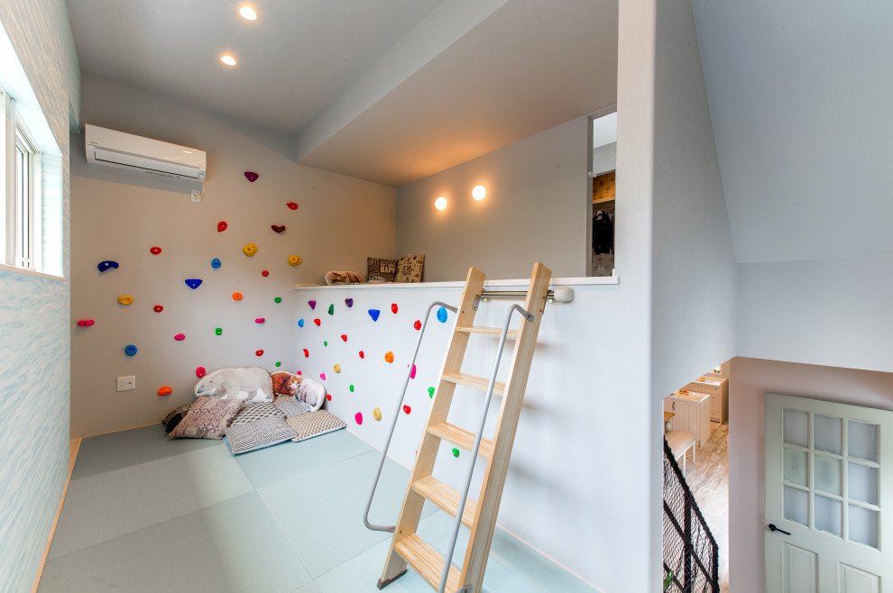 Inspiration for a kids' playroom in Other with white walls, wallpaper and wallpaper.