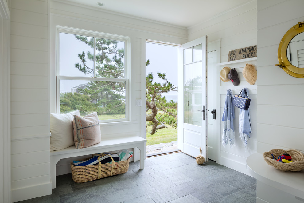 Beach style foyer in Providence with white walls, a single front door, a white front door and grey floor.