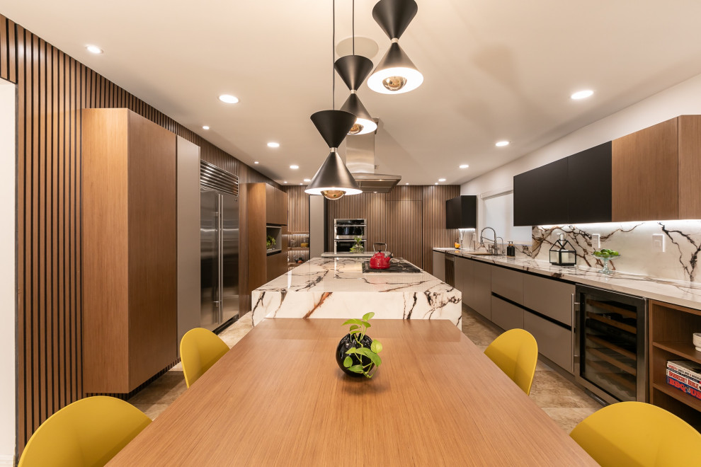 Photo of a large contemporary kitchen/diner in Miami with multiple islands.