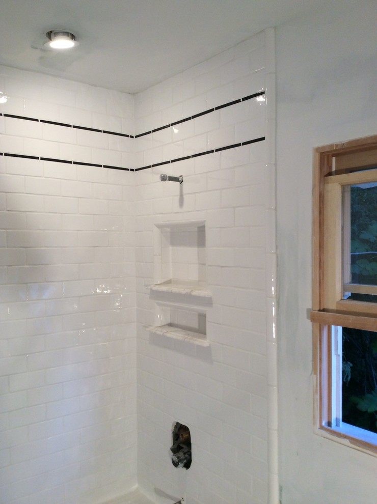 Design ideas for a mid-sized traditional 3/4 bathroom in Los Angeles with an alcove tub, a shower/bathtub combo, black and white tile, gray tile, subway tile, white walls and mosaic tile floors.