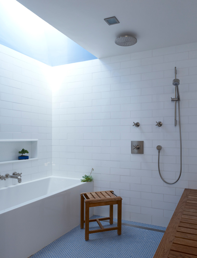 Photo of a contemporary bathroom in New York with an alcove tub, an open shower, white tile, subway tile, mosaic tile floors, blue floor and an open shower.