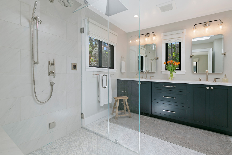 Inspiration for a large transitional master bathroom in San Francisco with shaker cabinets, black cabinets, a curbless shower, white tile, porcelain tile, grey walls, porcelain floors, an undermount sink, engineered quartz benchtops, white floor, a hinged shower door, white benchtops, a shower seat, a double vanity and a built-in vanity.