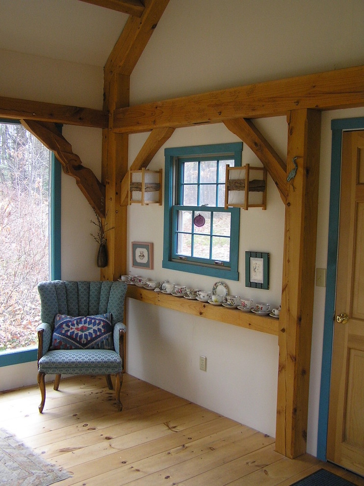 Inspiration for a small rustic light wood floor front door remodel in Boston with beige walls and a light wood front door