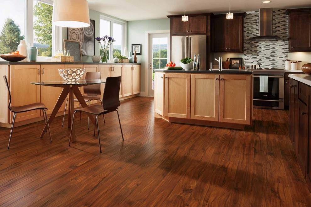 Inspiration for a mid-sized transitional l-shaped dark wood floor eat-in kitchen remodel with an undermount sink, shaker cabinets, medium tone wood cabinets, granite countertops, multicolored backsplash, matchstick tile backsplash, stainless steel appliances and an island