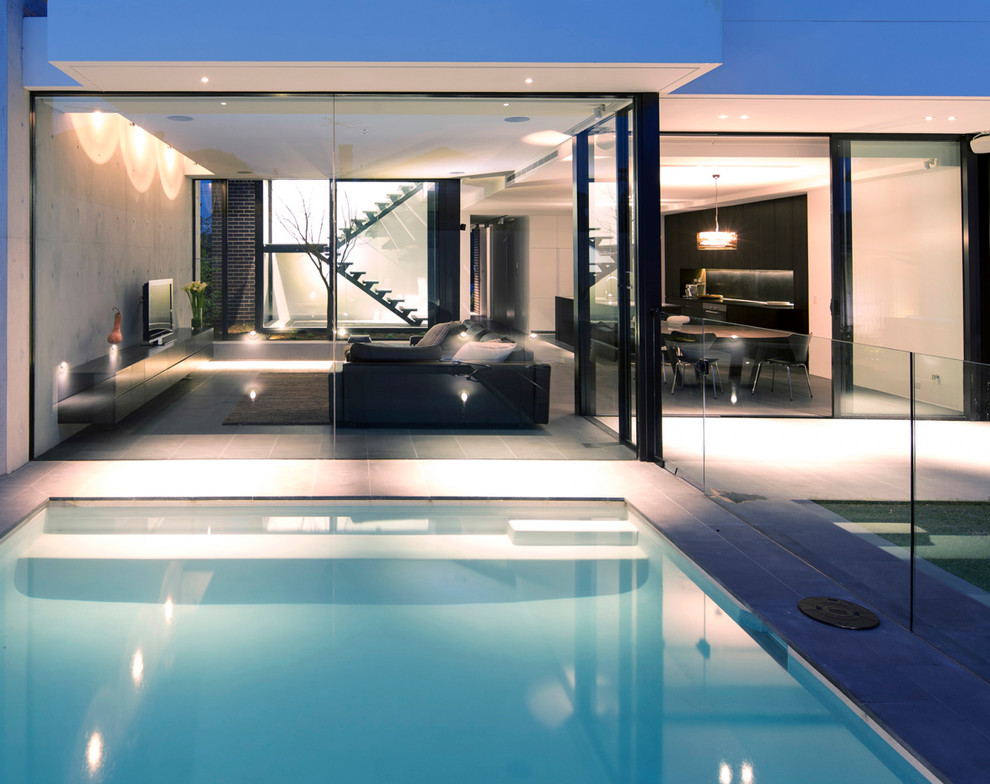 Inspiration for a mid-sized contemporary backyard rectangular pool in Sydney with tile.