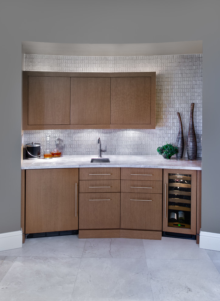 Inspiration for a small contemporary wet bar in Miami with an undermount sink, flat-panel cabinets, medium wood cabinets, quartz benchtops, beige splashback, glass tile splashback, marble floors, white floor and beige benchtop.