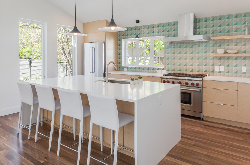 Design ideas for a mid-sized modern single-wall eat-in kitchen in Denver with an undermount sink, flat-panel cabinets, light wood cabinets, quartzite benchtops, multi-coloured splashback, timber splashback, stainless steel appliances, medium hardwood floors, with island and brown floor.