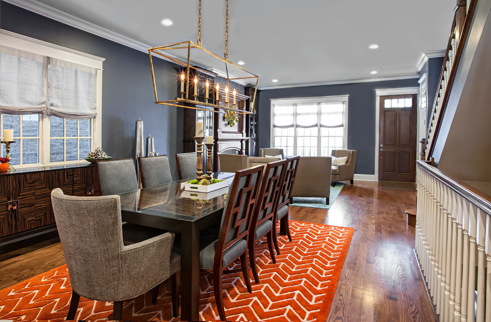 Mid-sized transitional open plan dining in Chicago with blue walls and medium hardwood floors.