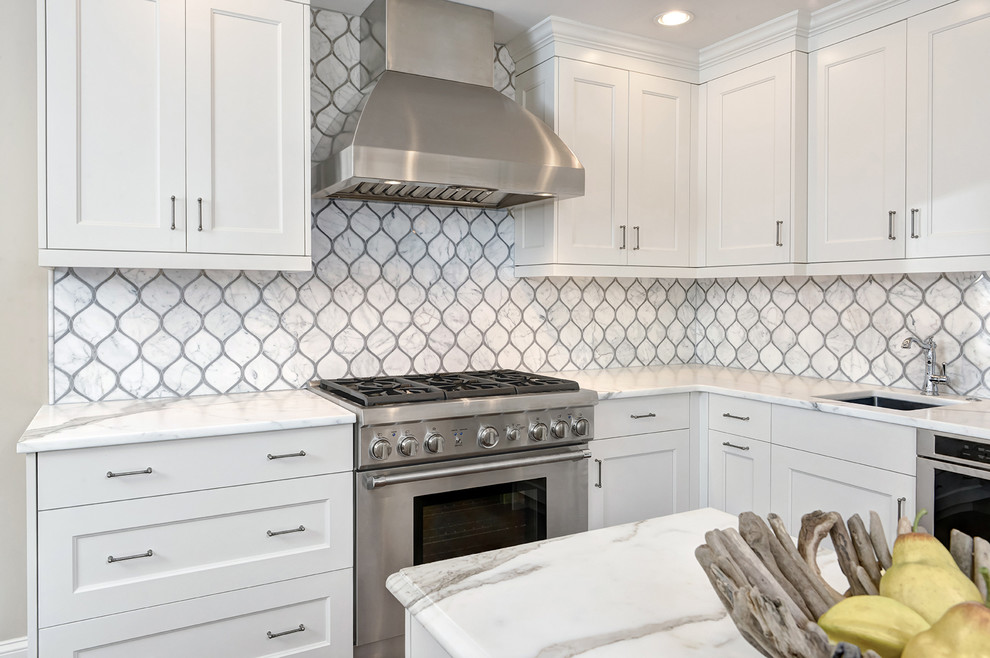 Transitional dark wood floor enclosed kitchen photo in Charleston with recessed-panel cabinets, white cabinets, granite countertops, white backsplash, mosaic tile backsplash, stainless steel appliances and an island