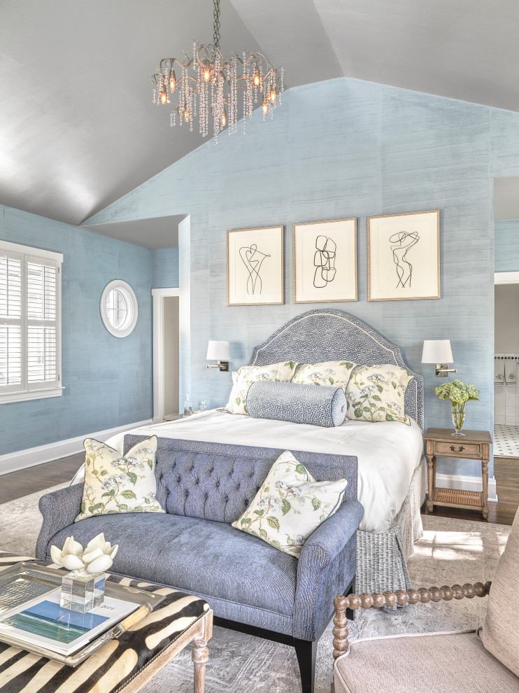 Photo of a large classic master bedroom in St Louis with blue walls, brown floors, a vaulted ceiling, dark hardwood flooring and wallpapered walls.
