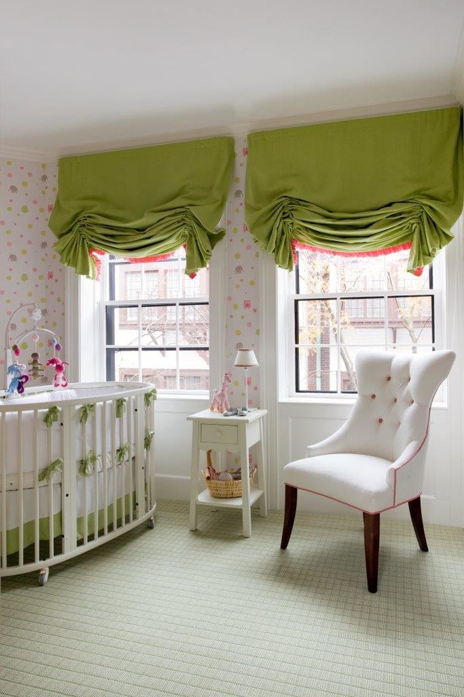 This is an example of a mid-sized traditional nursery for girls with pink walls, carpet and grey floor.