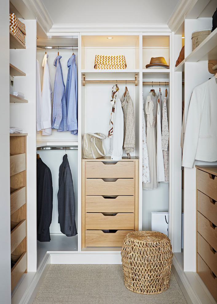 Inspiration for a contemporary storage and wardrobe in London with beige floor.