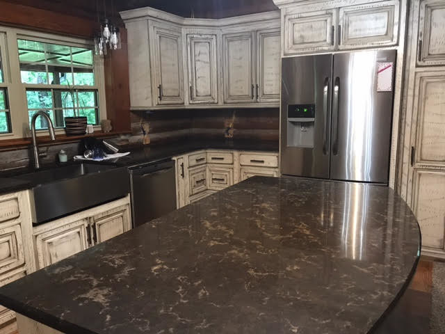 Eat-in kitchen - large rustic u-shaped medium tone wood floor and brown floor eat-in kitchen idea in Birmingham with a farmhouse sink, raised-panel cabinets, distressed cabinets, stainless steel appliances and an island