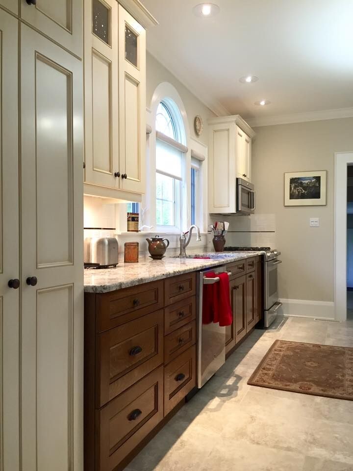 Inspiration for a mid-sized transitional kitchen remodel in Toronto with an undermount sink, recessed-panel cabinets, medium tone wood cabinets, granite countertops and stainless steel appliances
