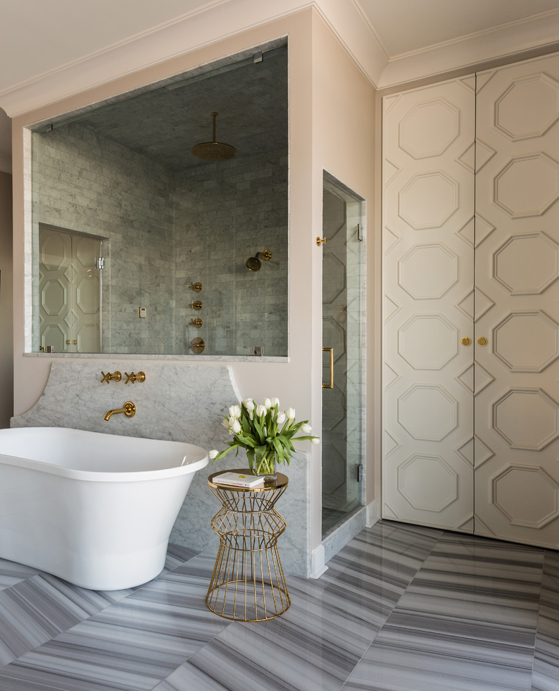 Design ideas for a large transitional master bathroom in Little Rock with beige cabinets, a freestanding tub, a double shower, white tile, beige walls, marble floors and marble benchtops.