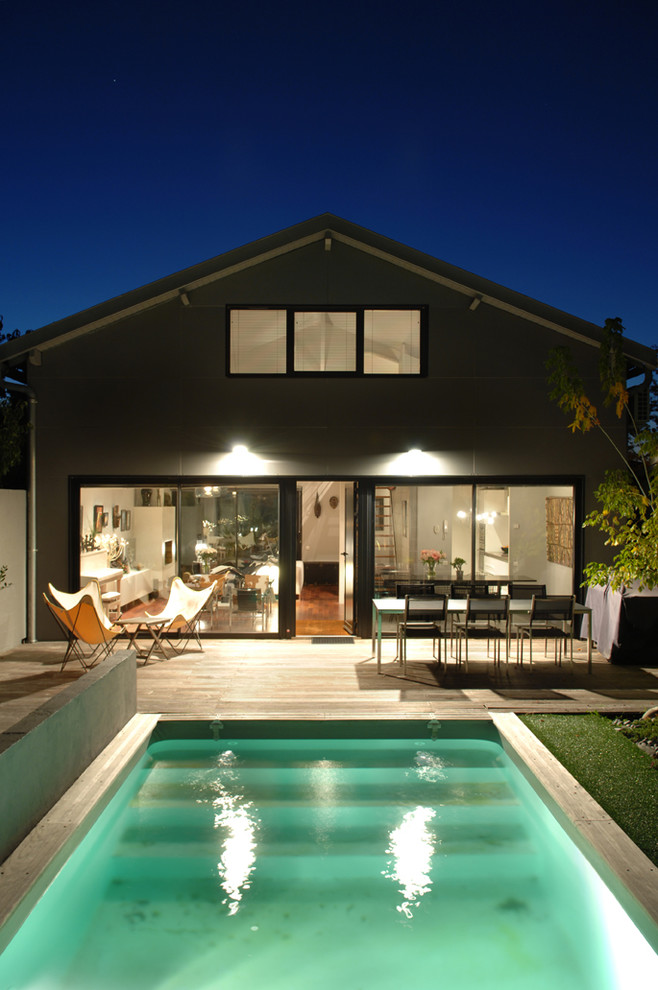 Inspiration for a contemporary backyard rectangular pool in Bordeaux with decking.