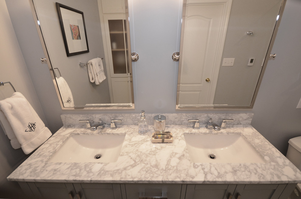 Inspiration for a mid-sized traditional master bathroom in Charlotte with shaker cabinets, grey cabinets, an alcove shower, a two-piece toilet, gray tile, stone slab, blue walls, marble floors, an undermount sink and marble benchtops.