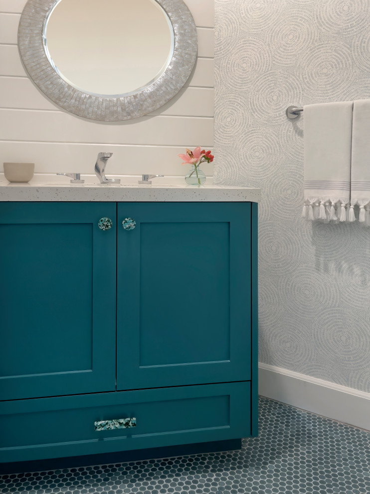 Photo of a small coastal cloakroom in Orange County with shaker cabinets, green cabinets, a one-piece toilet, white walls, mosaic tile flooring, a submerged sink, engineered stone worktops, green floors, white worktops, a built in vanity unit and wallpapered walls.