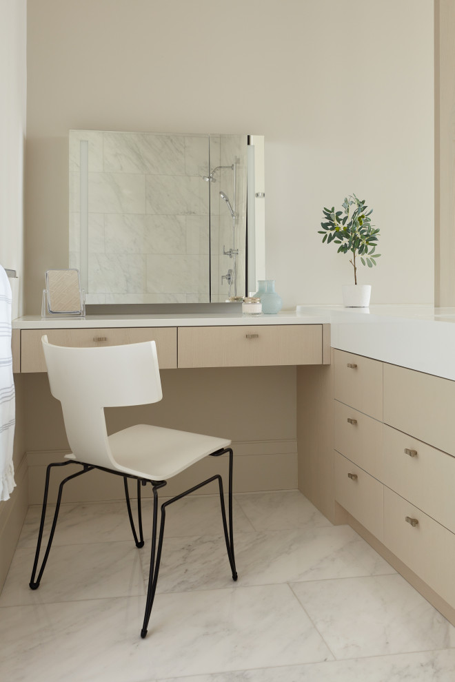 Inspiration for a medium sized traditional ensuite bathroom in Toronto with flat-panel cabinets, light wood cabinets, an alcove shower, beige walls, marble flooring, marble worktops, white floors, a hinged door, white worktops and a built in vanity unit.