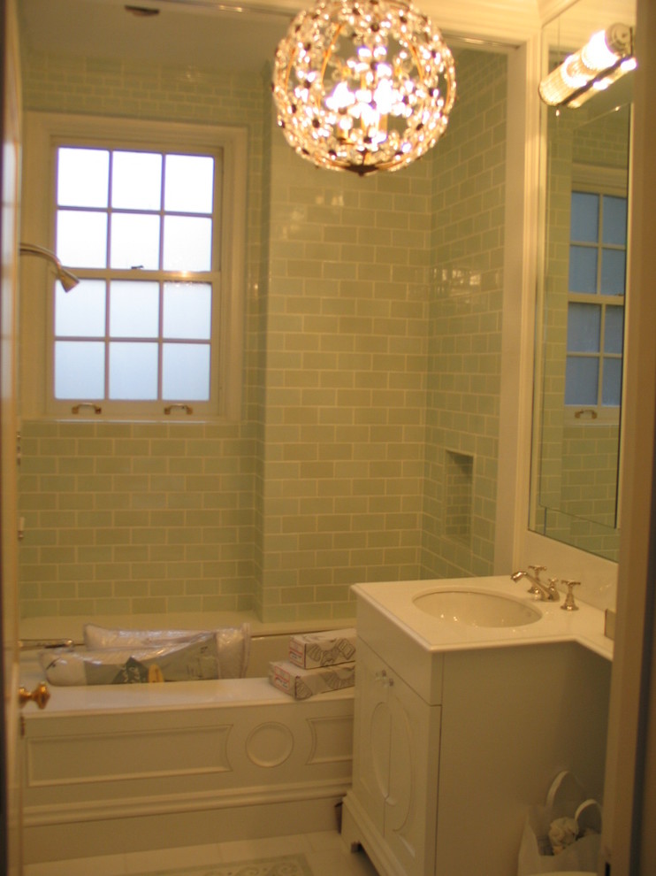 Alcove bathtub - small traditional 3/4 green tile and subway tile ceramic tile and white floor alcove bathtub idea in New York with recessed-panel cabinets, white cabinets, a one-piece toilet, green walls, an undermount sink and marble countertops