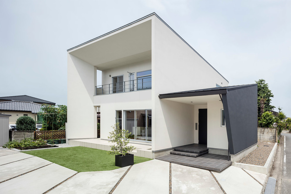 Inspiration for a contemporary white exterior in Tokyo Suburbs with a shed roof.
