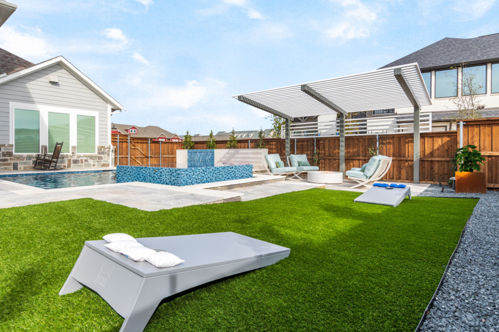 Mid-sized transitional backyard stone and custom-shaped pool photo in Dallas