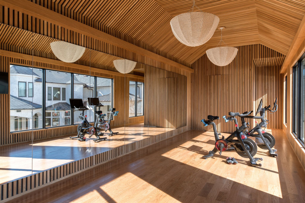 Medium sized contemporary home yoga studio in Dallas with brown walls, light hardwood flooring, brown floors and a wood ceiling.