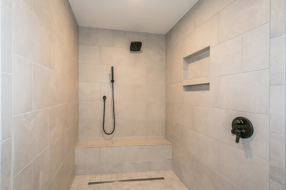 This is an example of a large country master bathroom in Portland with shaker cabinets, dark wood cabinets, a freestanding tub, an open shower, a two-piece toilet, gray tile, porcelain tile, grey walls, ceramic floors, an undermount sink, quartzite benchtops, grey floor, an open shower, white benchtops, a shower seat, a double vanity and a built-in vanity.