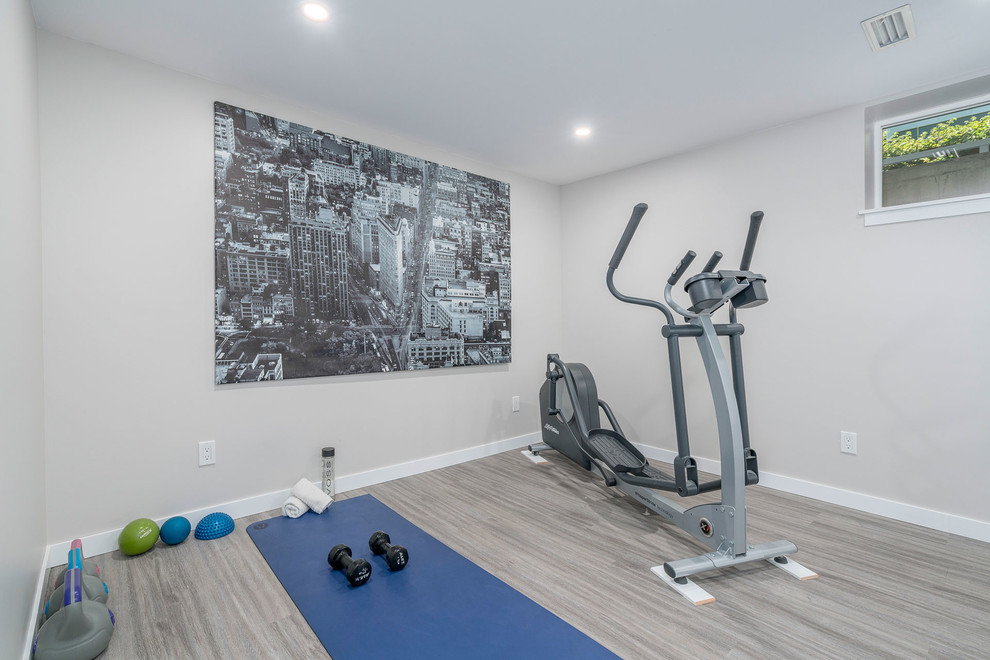Inspiration for a mid-sized contemporary multipurpose gym in Vancouver with grey walls and grey floor.