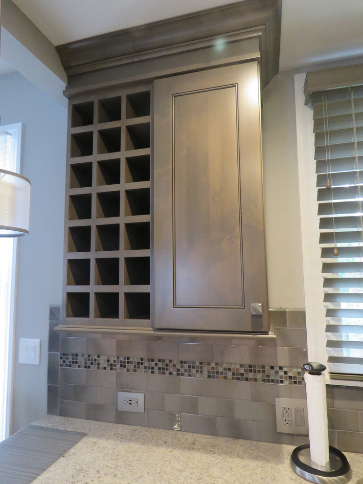 Eat-in kitchen - mid-sized transitional u-shaped ceramic tile and beige floor eat-in kitchen idea in Philadelphia with an undermount sink, shaker cabinets, gray cabinets, quartzite countertops, gray backsplash, subway tile backsplash, stainless steel appliances and an island